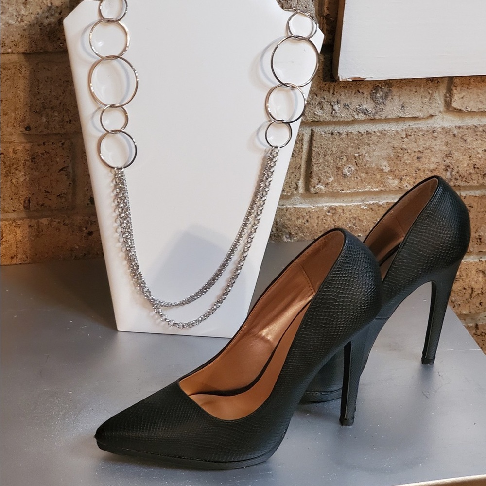 Charlotte Russe 4 inch heel , matte finish, and faux leather material.